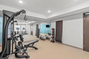 a fitness room with a gym with exercise equipment at WoodSpring Suites Atlanta Canton in Canton