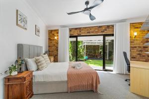 a bedroom with a bed and a ceiling fan at The Hidden Gem in Tamborine Mountain in Tamborine +18 photos