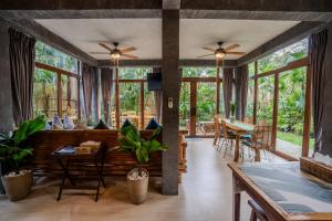 a living room with a couch and a table at Buko Beach Resort in El Nido