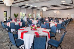 a ballroom with tables and chairs and tablesktop at Hilton Garden Inn Akron in Akron +33 photos
