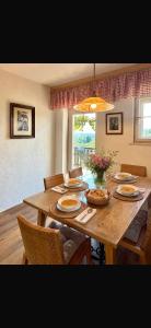 a dining room table with plates of food on it at Haloze Chill in Podlehnik +16 photos