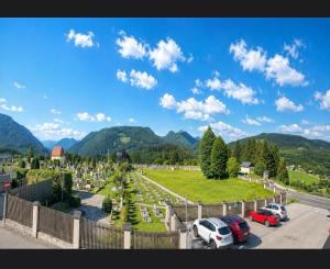 a parking lot with cars parked in a cemetery at Casa Roberto, Apartment 2 in Mariazell +2 photos