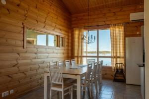 a dining room with a table and chairs at Oravi Villa 1 Teeri in Savonlinna