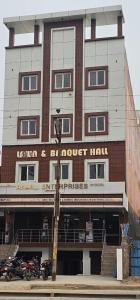 a building with motorcycles parked in front of it at Hotel Sunny in Varanasi
