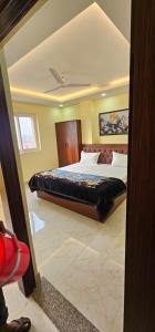 a bedroom with a large bed in a room at Hotel Sunny in Varanasi