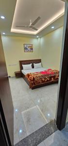 a bedroom with a bed in a room at Hotel Sunny in Varanasi +4 photos