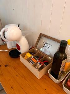 a wooden box with a bottle of wine on a table at Roche for Toit in Rochefort +10 photos