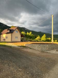 a house sitting on the side of a road at Lipovo Mountain House in Kolašin