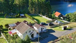 an aerial view of a house with solar panels at Cozy Fjord Studio in Åna-Sira Near Brufjell and Jøssingfjord in Flekkefjord