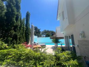 a view of a pool from a house at Panorama Hills Villa with Pool in Thessaloniki