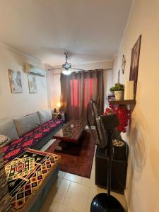 a living room with a couch and a table at Chalet in Belagio Ain Sokhna in Ain Sokhna +15 photos