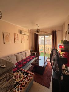 a living room with a couch and a table at Chalet in Belagio Ain Sokhna in Ain Sokhna