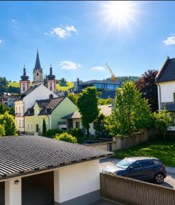a car parked in a parking lot in a town at Casa Roberto, Apartment 2 in Mariazell