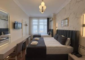 a hotel room with a bed and a mirror at Hotel Tulip House in Istanbul