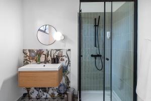 a bathroom with a sink and a shower at Wathay Vendégház in Csesznek +18 photos