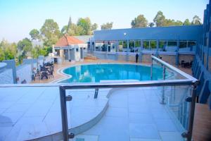 a large swimming pool on top of a building at Moorlandhouse & SPA in Migori