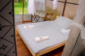 a bed in a room with two rings on it at Buvi Camp in Buvi