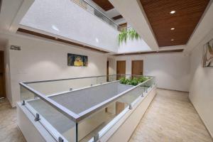 a large empty room with a large tennis court at Hotel Premji, Dwarka in Dwarka