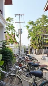 a row of bikes parked next to a building at Asoca Hotel Luang Prabang in Luang Prabang +114 photos