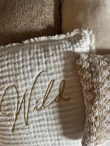 a pillow with the word faith written on it at Escapade in Saint-Jouin-Bruneval