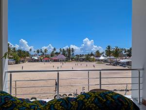 a view of a beach from a balcony at Villa Goli 3BR Private Pool Villa, Paje in Zanzibar City +54 photos