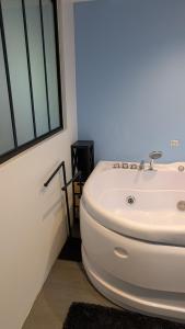 a bathroom with a white sink next to a window at HOME HOSE in Monistrol-sur-Loire +21 photos