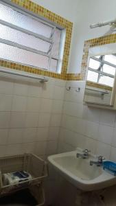 Um banheiro em Villa Centrale - Ótima localização no centro de Ubatuba