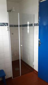 Um banheiro em Villa Centrale - Ótima localização no centro de Ubatuba