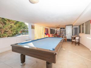a pool table in a living room at Arora Hotel in Kuşadası