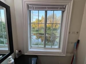 a window in a bathroom with a view of the water at Private unit in richmond hill in Richmond Hill