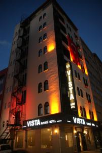 a building with a sign on the side of it at Vista Kayseri Hotel in Kayseri