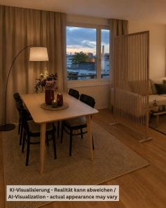 ein Wohnzimmer mit einem Tisch mit Stühlen und einem Bett in der Unterkunft Valo Central - Wohnung mit Arbeitsplatz am Zürichsee in Pfäffikon