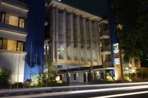 a night view of a building at night at Grand Orchid Hotel Solo in Solo