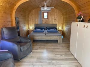 a bedroom with a bed and a chair in a room at Finca Tolomó in Aspe +46 photos