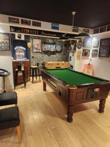 a room with a pool table in a room at Chambre d hote in Le Tignet