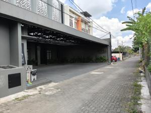 an empty street in front of a building at D'CIA Coliving in Kejayan