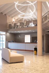 a large room with a couch in the middle of it at LVG Hotel Collection - Riz in San Genesio ed Uniti +59 photos