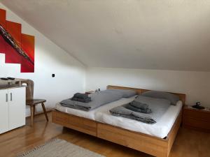 a bedroom with a bed with pillows on it at Appartement Blickfang in Bruck an der Mur