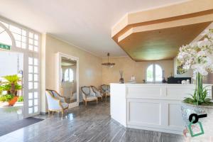 a living room with a kitchen and a dining area at Hotiday San Felice Circeo in San Felice Circeo