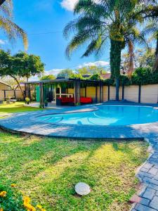 a house with a swimming pool in the yard at No 80 At Erasmus in Polokwane