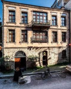 a building with a bike parked in front of it at Palea Poli Boutique Hotel in Naousa