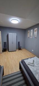 a room with a bed and two chairs in it at Monteurwohnungwgapartment In 50129 in Bergheim