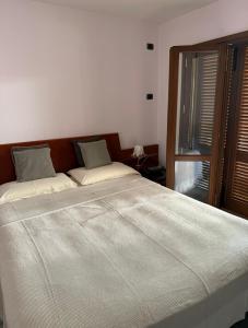 เตียงในห้องที่ Loretino