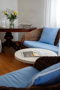 a living room with two chairs and a table at Hotel Telenia in Lido di Jesolo