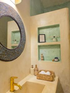 a bathroom with a sink and a mirror at Ocean zuri villa in Watamu