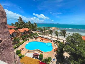 an aerial view of a resort with a swimming pool and the beach at SWIMS! a Social Beach Resort in Haad Rin