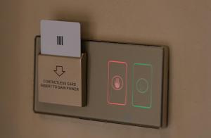 a box and aswitch on a wall with a box at Pournari Center Toroni in Toroni