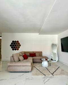 a living room with a couch and a table at Villa Olimpia in Civitavecchia