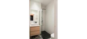 a bathroom with a shower and a toilet at Doux Pavillon - La Palmeraie in Nice