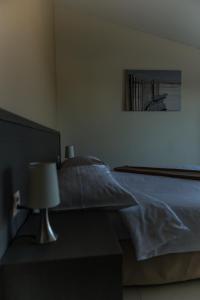 Postel nebo postele na pokoji v ubytování Motel Le Léman